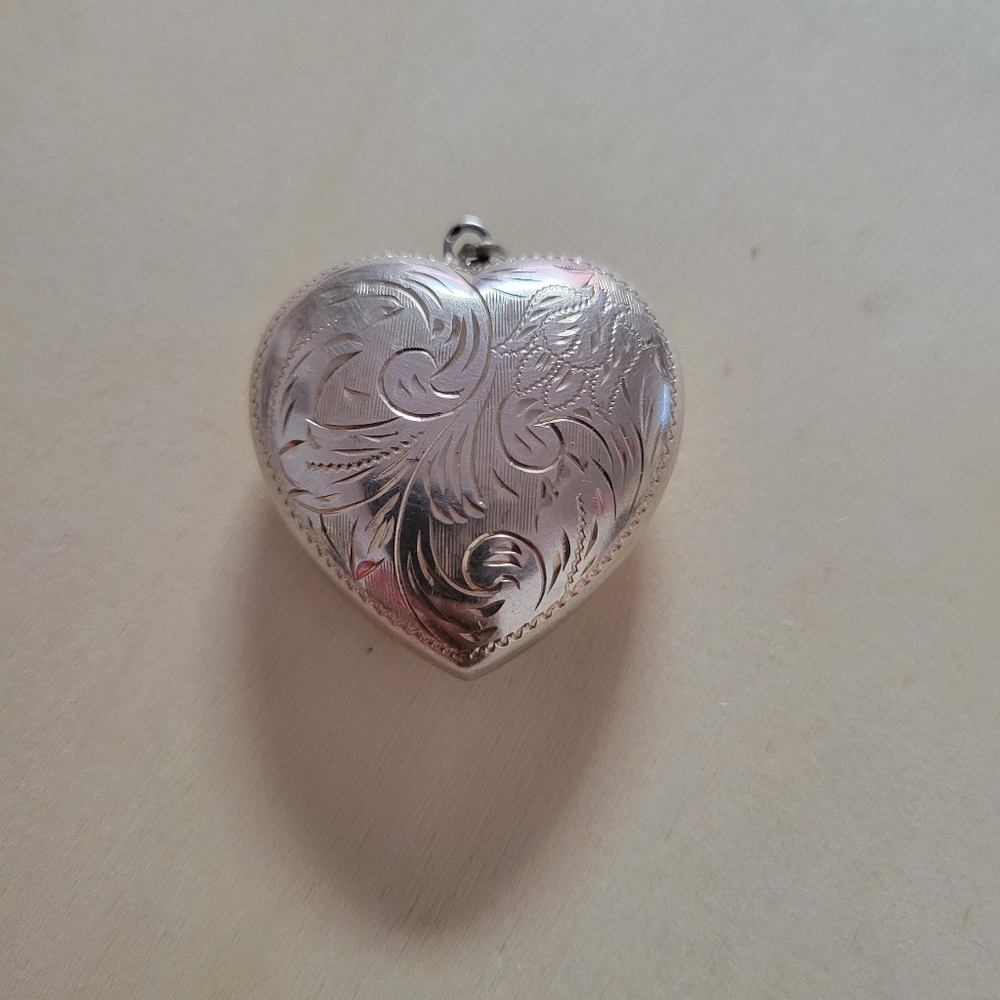 Sterling silver puffed etched head pendant